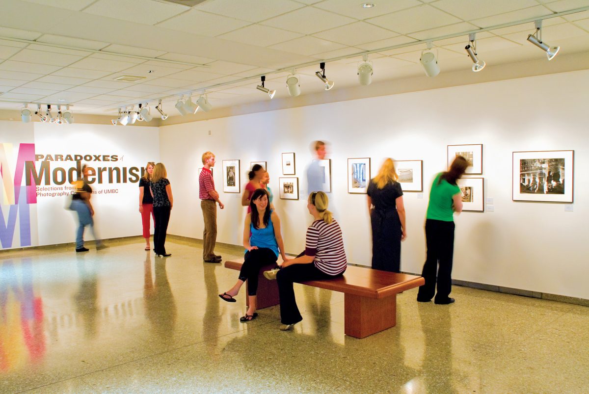 Image of people viewing a photography exhibition