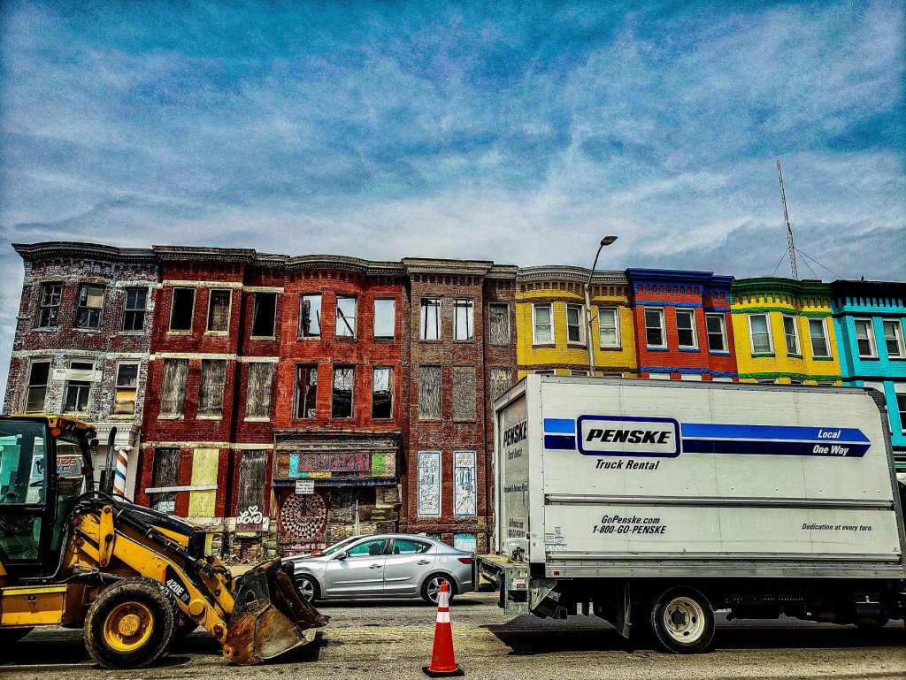 Row houses with automobiles in the street
