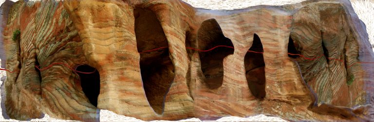 Cliffs with red line drawn through openings
