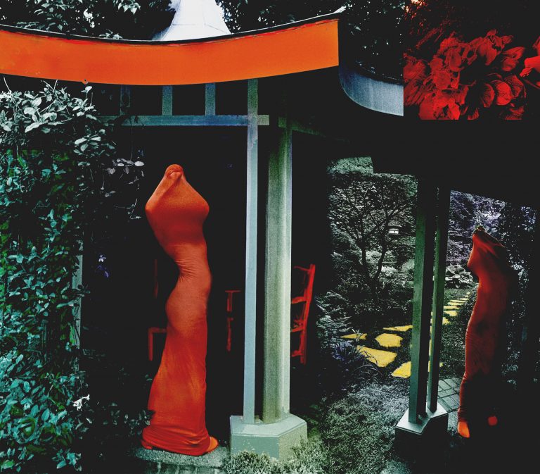 Two figures shrouded in red in Japanese garden pavillion
