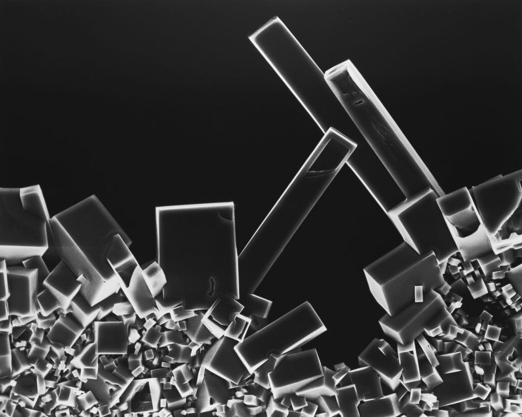 Black and white photograph of sodium chloride crystals under magification